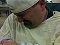 Jason holding Harrison for the first time