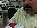 Jason holding Harrison for the first time